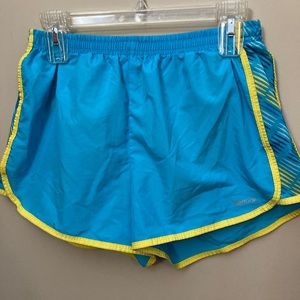 blue and yellow reebok running shorts